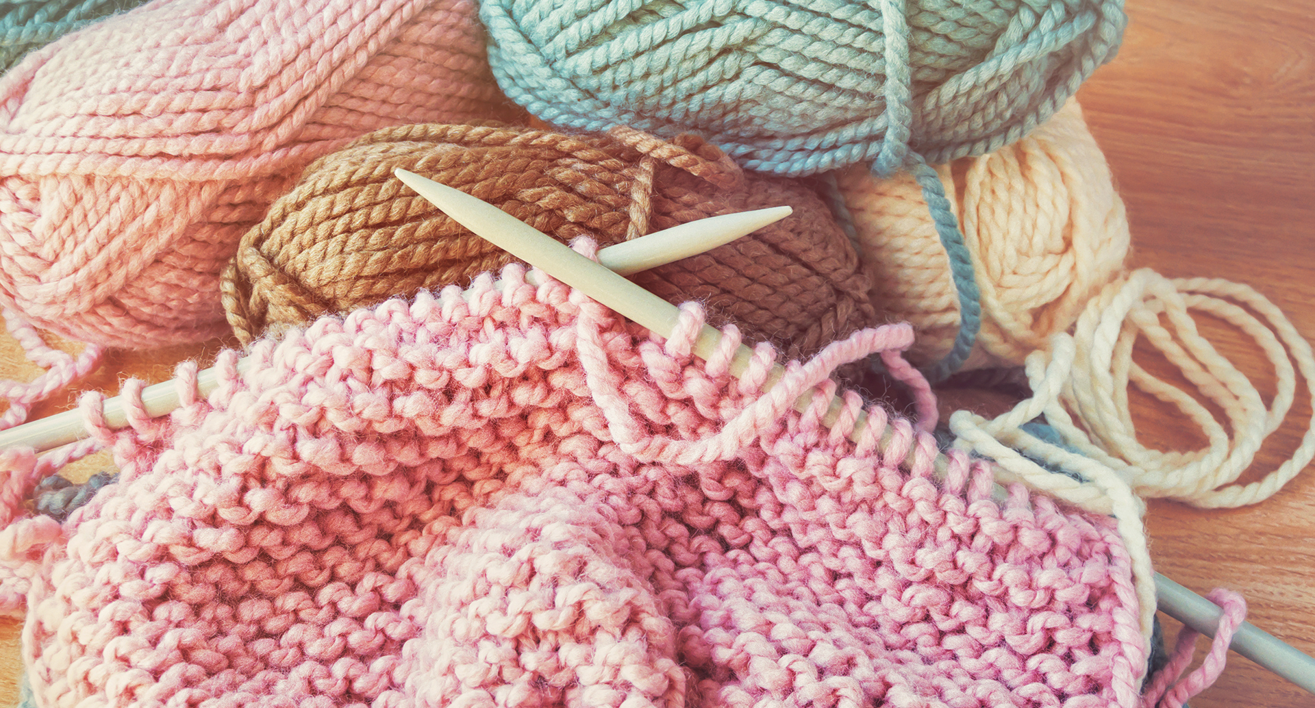 Knitting needles and balls of wool