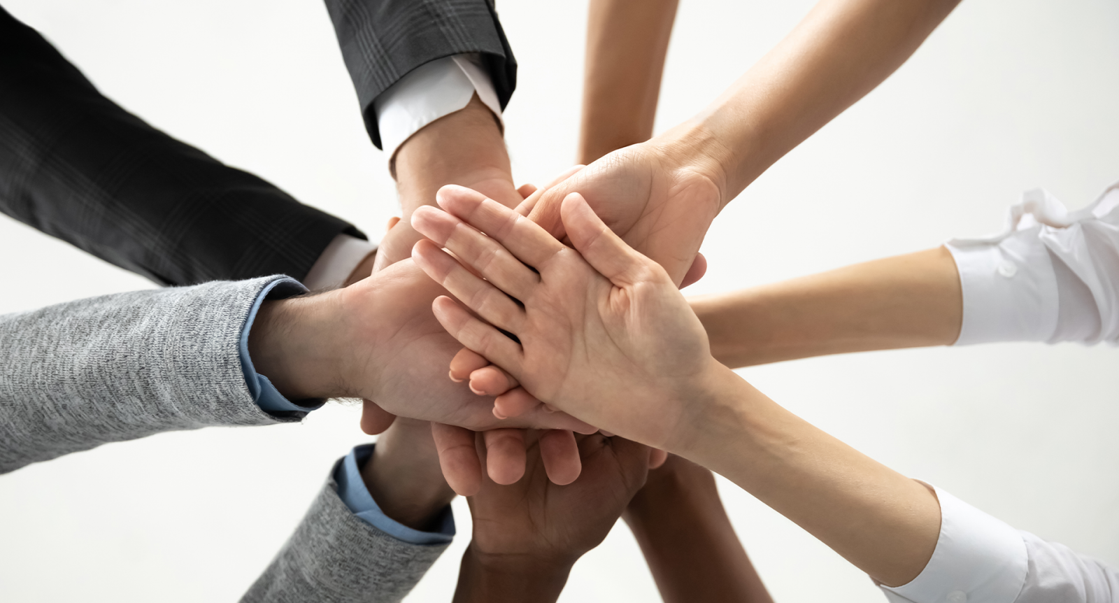 Hands Piling in for team celebration banner image