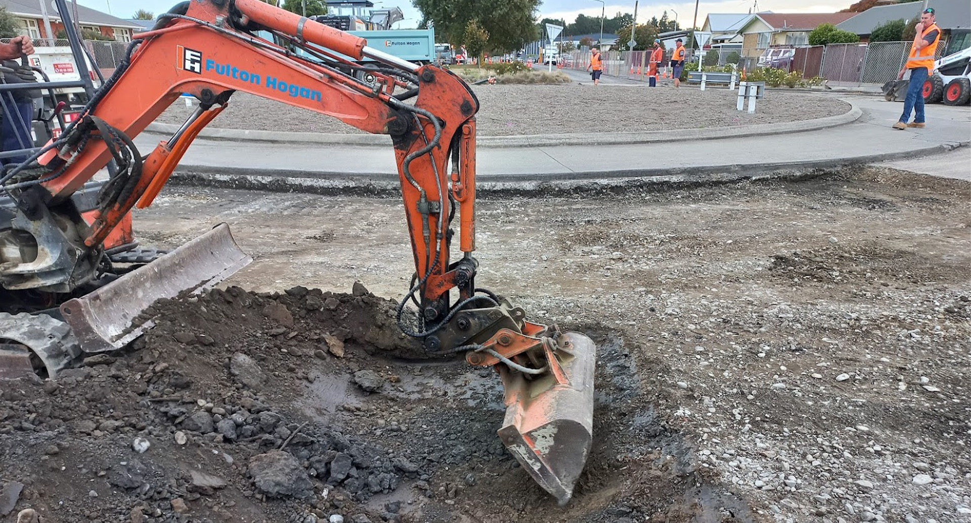 Digger working on road