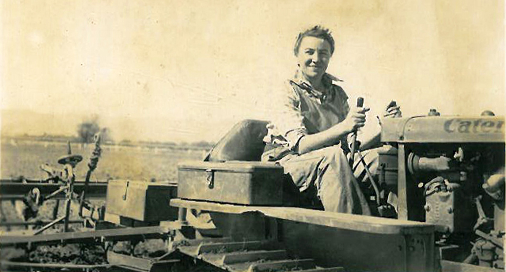 Woman driving tractor during war times