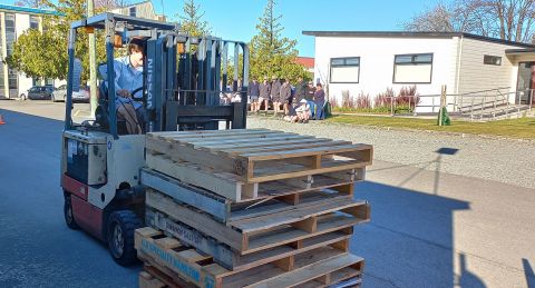 Morning tea shout to mark students' progress at forklift training