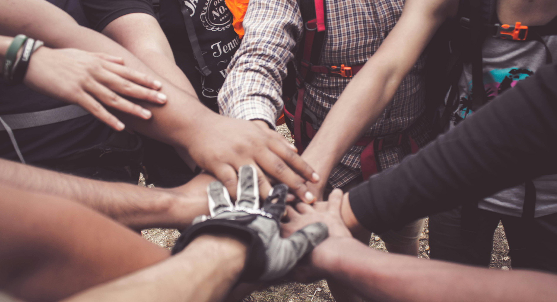 Lots of hands together in circle